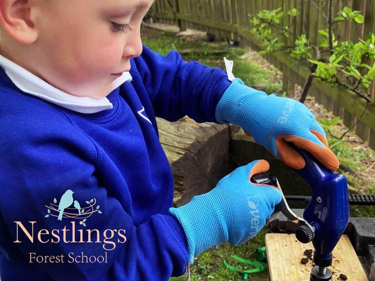 Woodwork boy drilling